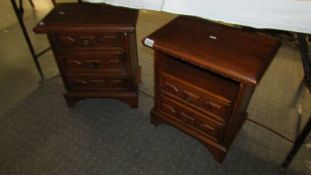 A pair of mahogany bedsides.