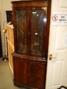 A mahogany corner unit.