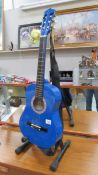 A blue finished Lauren guitar, model 25N-BL (stand not included).