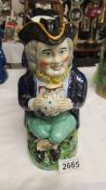 A Victorian Toby jug with lid.