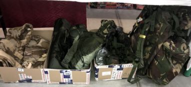 A Military back pack & contents including body armour, camp bed, Mess tins etc.