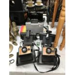 A quantity of various Polaroid cameras