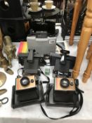 A quantity of various Polaroid cameras