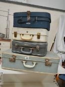 4 good suitcases including vanity.