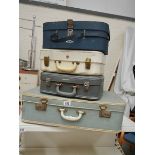4 good suitcases including vanity.
