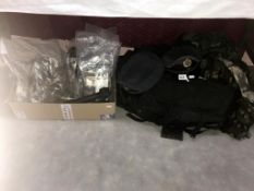 A large holdall of Military clothes, some sealed including RAF caps & a Webley & Scott .