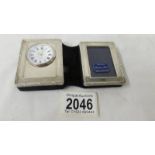 A hall marked sterling silver 1999 photo frame / clock.