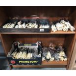 A large quantity of knives & forks including fish knives & forks (2 shelves)