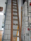 A 12 double rung wood ladder in good condition.