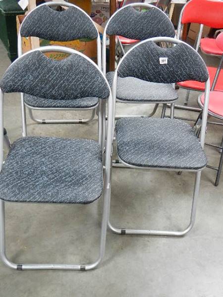 A set of 4 folding kitchen chairs.