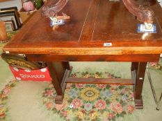 A mid 20th century oak draw leaf table.