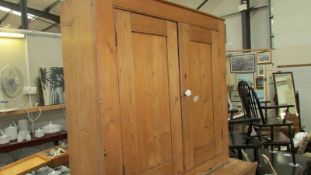 A Victorian pine 2 door cupboard, 91 x 31 x 91 cm.