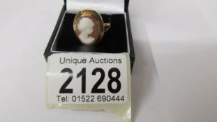 A 9ct gold ring set shell cameo, size S, 5.4 grams total weight.