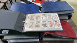 10 folders of assorted cigarette cards.