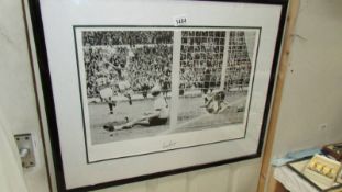 A Martin Peters signed football print of 1966 with certificate of authentication. 72 x 58 cm.