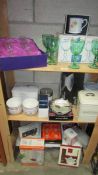 3 shelves of mostly new boxed household items including Edinburgh crystal champagne glasses.