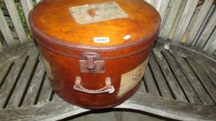 A large vintage well travelled hat box, 47.5 cm diameter x 31 cm high.