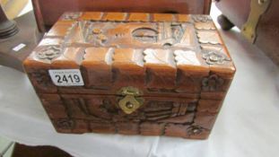 A carved wood box.