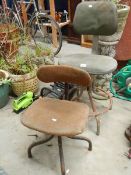 Two old metal factory chairs.