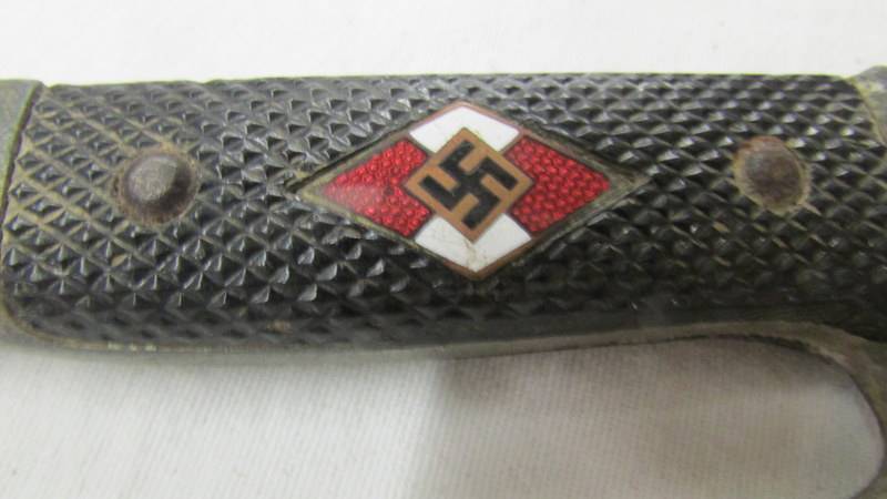 A WW2 German dagger with enamel insignia and stamped RZ M 7/27 1941 on blade. - Image 3 of 5