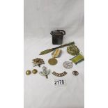 A mixed lot of medals and militaria including trench art 1917 chiselled coin,