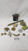 A mixed lot of medals and militaria including trench art 1917 chiselled coin,