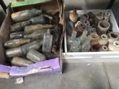 A box of clay glazed pots & bottles & another box of bottles