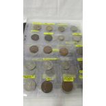 An album of in excess of 100 world coins.