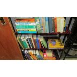 Three shelves of books, mainly related to chemistry.