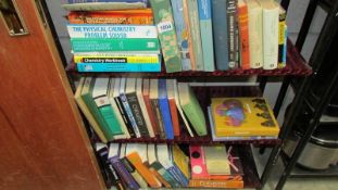 Three shelves of books, mainly related to chemistry.