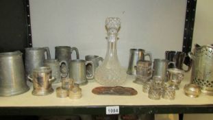 A mixed lot of pewter tankards, silver plate bottle holder, decanter etc.