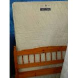 A Silentnight 5 ft mattress with pine bed frame.