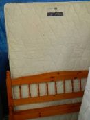 A Silentnight 5 ft mattress with pine bed frame.