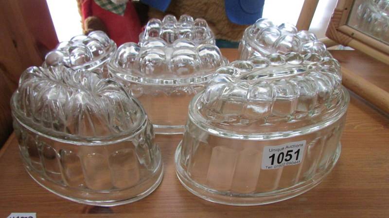 A collection of vintage moulded glass jelly moulds.