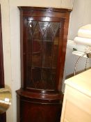 A mahogany corner unit.