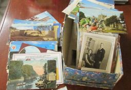 A box of assorted vintage postcards.