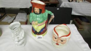 A colourful Toby jug and 2 others.