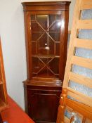 A mahogany corner unit.