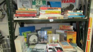 2 shelves of books relating to transport, trains, sailing, cars etc.