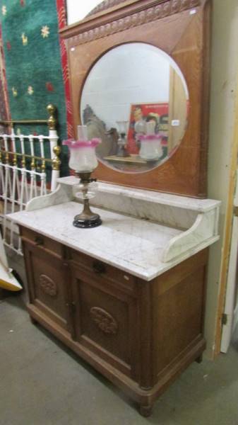 A 19th century marble top wash stand with mirror back.