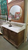 A 19th century marble top wash stand with mirror back.