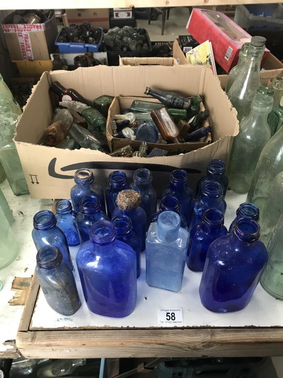 A large collection of blue glass & a box of various small potion bottles