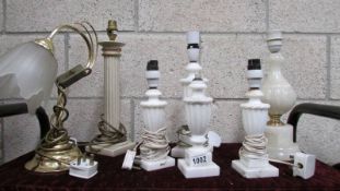 A quantity of alabaster and other table lamps.