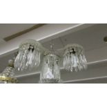 An unusual contemporary three lamp glass chandelier.