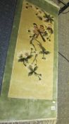 A good quality mid 20th century Chinese rug/wall hanging depicting birds and foliage.