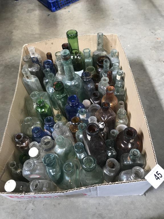 A box of coloured decorative bottles