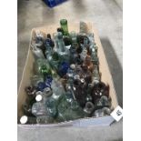 A box of coloured decorative bottles