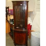 A mahogany corner unit.