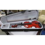 A modern cased violin with bow. (size 13.75").