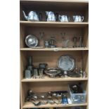 A good selection of silver plate, pewter & chrome plated tea set, toast rack, candelabra,